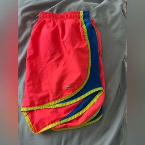 Pink and blue/yellow trim. Nike shorts